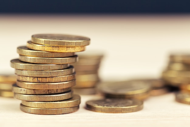 Piles of coins on working table