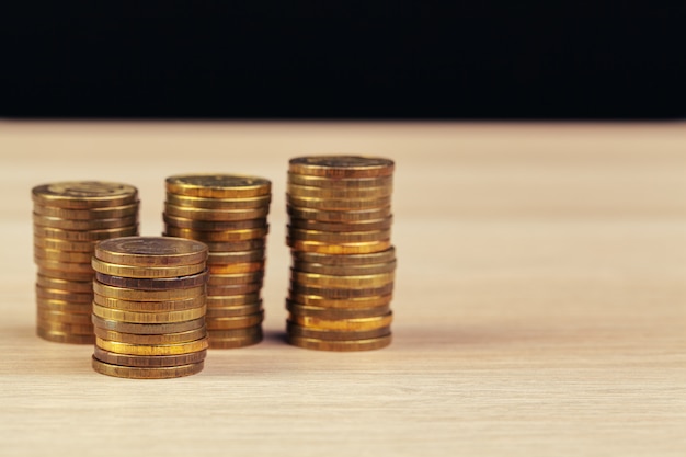 Piles of coins on working table