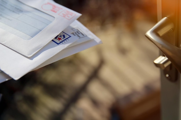 Piles of letters in a mail box outside