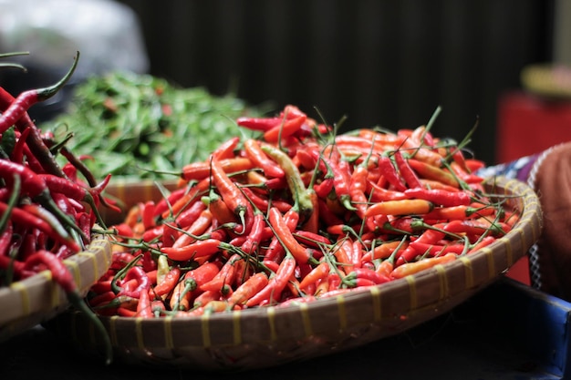 Piles of red chilies in a traditional market in winnowing