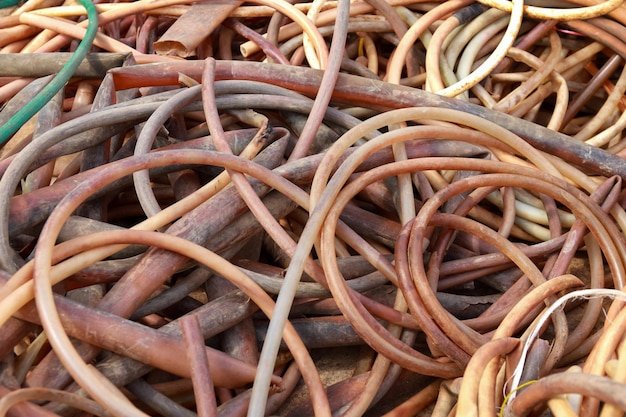 Piles of rubber hose awaiting recycling. Save the world concept