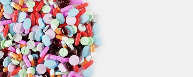 Pill background Many colorful pills medicines Pharmacy pharmaceuticals supplements and vitamins concept Close up Pills Tablets and capsules on white table