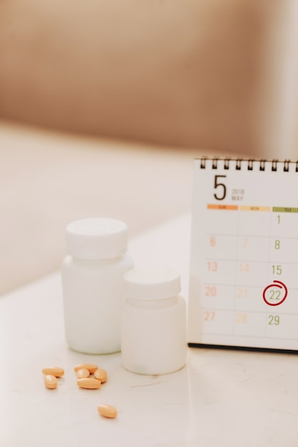 Pill box with a drug on table