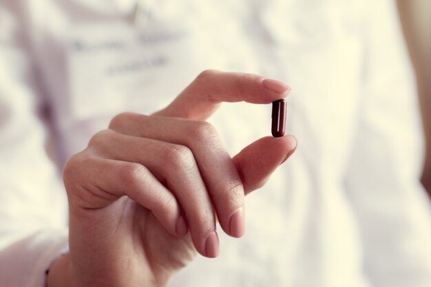 Pill capsules in a doctor's hand