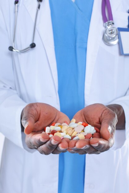 Pill in a hand isolated on white background Doctor Pill