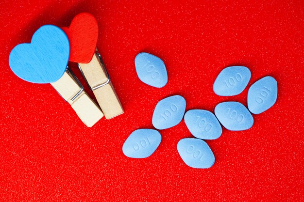 Pill for men's health and Valentine day background.