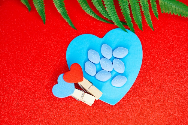 Pill for men's health and Valentine day background.