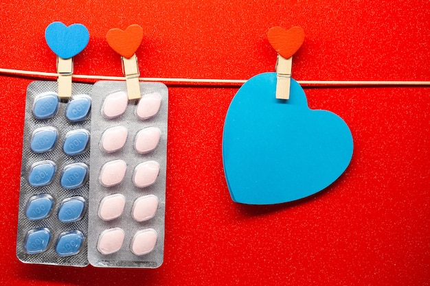 Pill for men's health and Valentine day background.