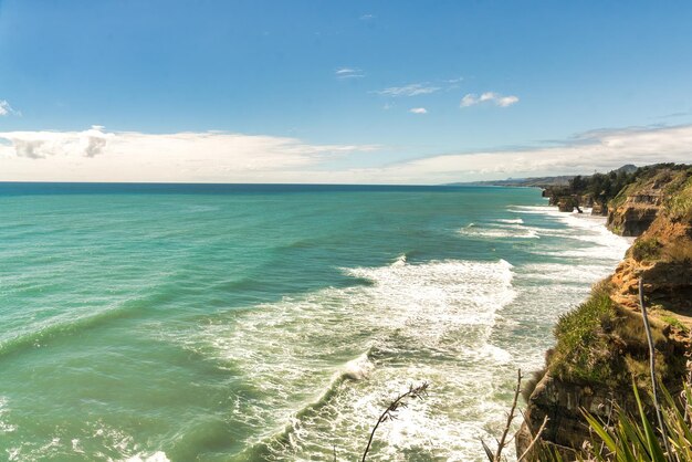 Pillars of rock rising from the sea on the Taranaki coastline