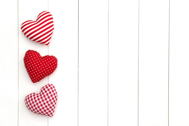 Pillow hearts on white table with copy space. Happy Valentine's day. 