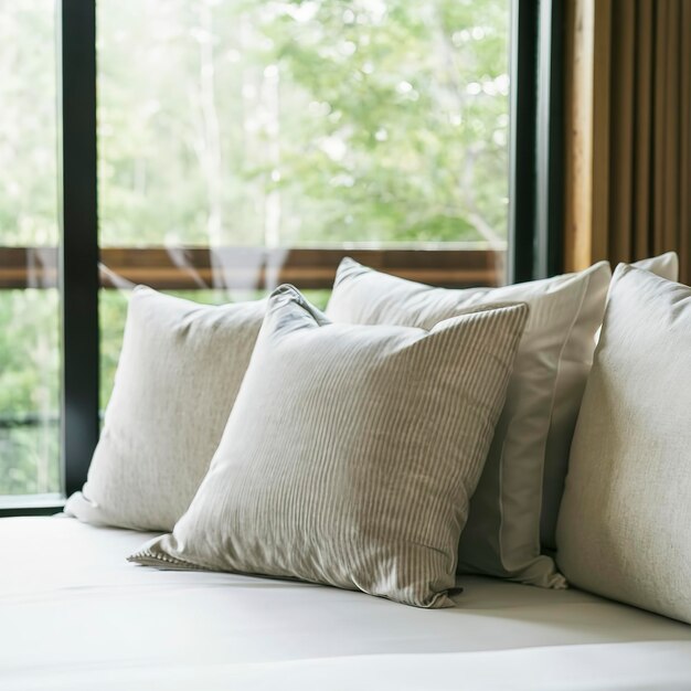 Pillow on sofa bed with outdoor view