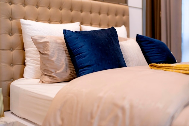 Pillows arranged on bed at home