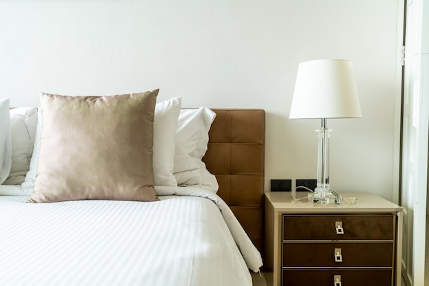 Pillows on bed in bedroom interior