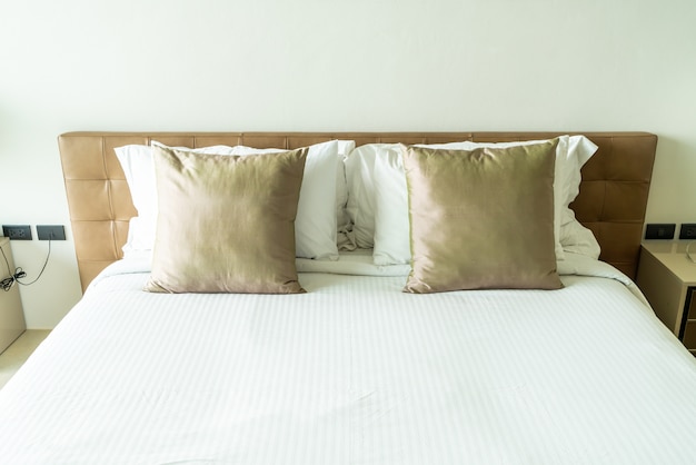 Pillows on bed in bedroom interior