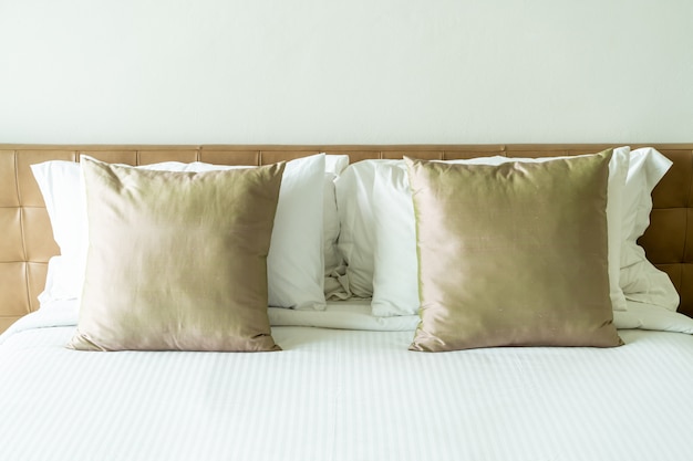 Pillows on bed in bedroom interior