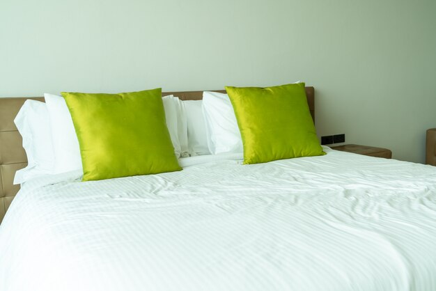 Pillows on bed in bedroom interior