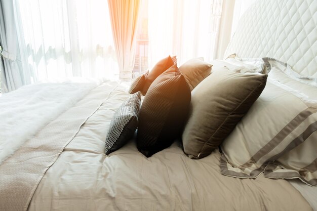 Photo pillows on bed at home