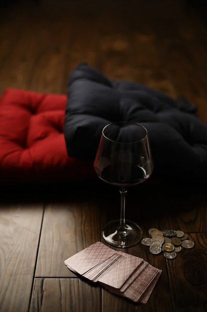 Pillows on a wooden parquet floor and a drink in a glass cup