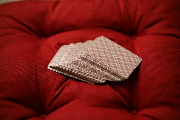 Pillows on a wooden parquet floor and a drink in a glass cup