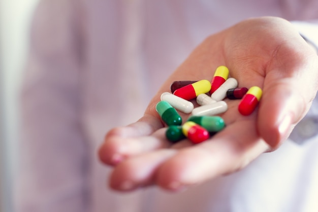 Pills capsules in a doctor's hand