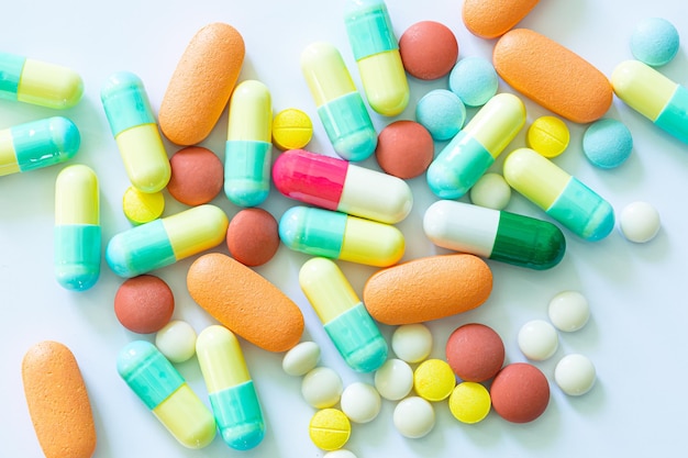 Pills and capsules on a white background,Different colorful pills on white background