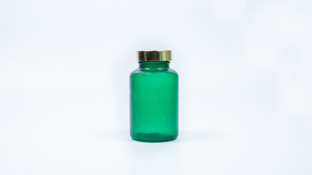 Pills from bottle on the white