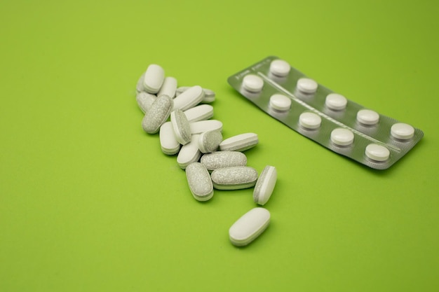 Pills on a green background