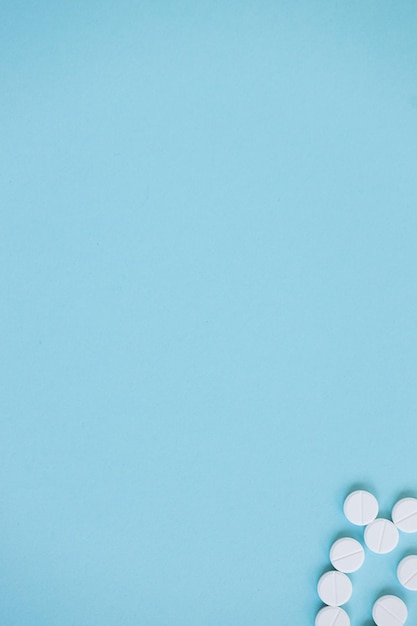 Pills isolated on blue background