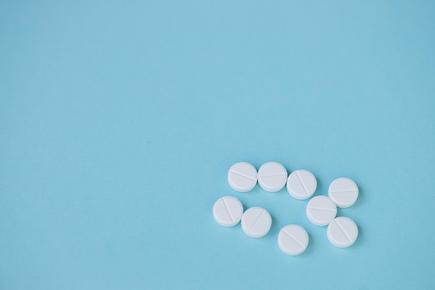 Pills isolated on blue background