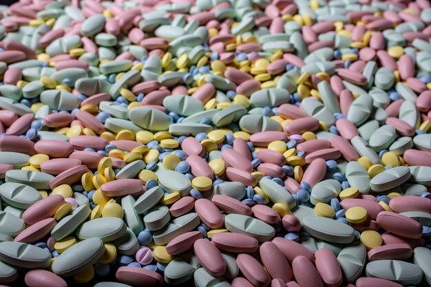 Pills lie on table background. drugs, painkillers, colds and
other medicines.