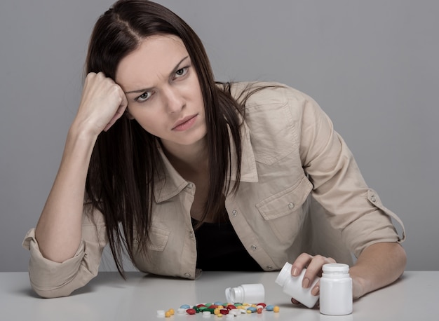 Pills lying on the table before suffering from the pain.