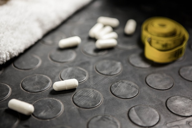 Pills and measuring tape at the crossfit gym