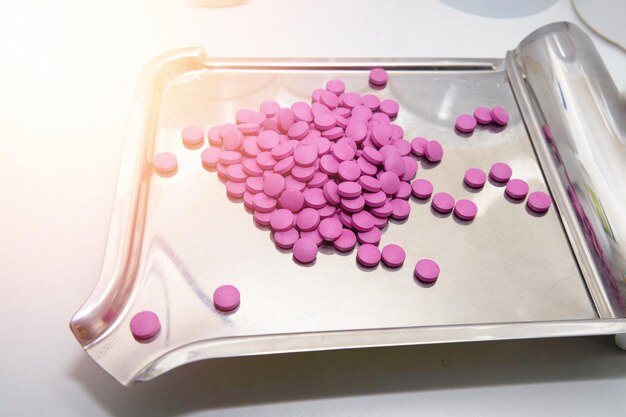 Pills on medinine tray in drug store in health concept