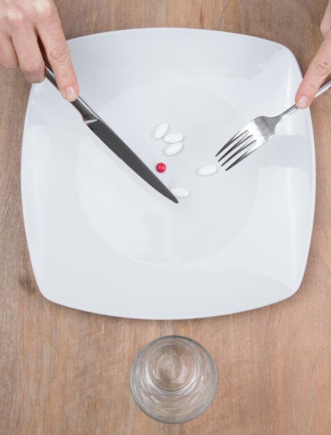 Pills on a plate as food supplement