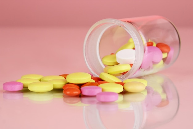 Pills in receptacle on red background