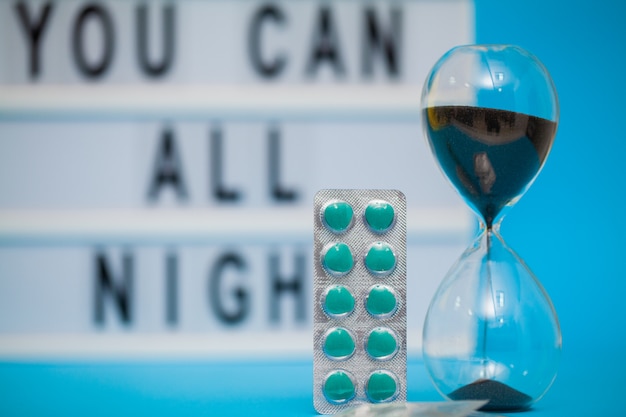 Pills for sexual male health on a blue surface