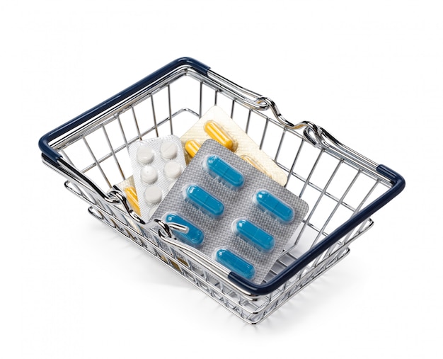 Pills on shopping cart or basket. Medical, pharmacy theme concept.