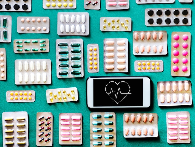 pills and tablets with smartphone 