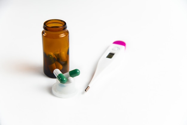 Pills and thermometer