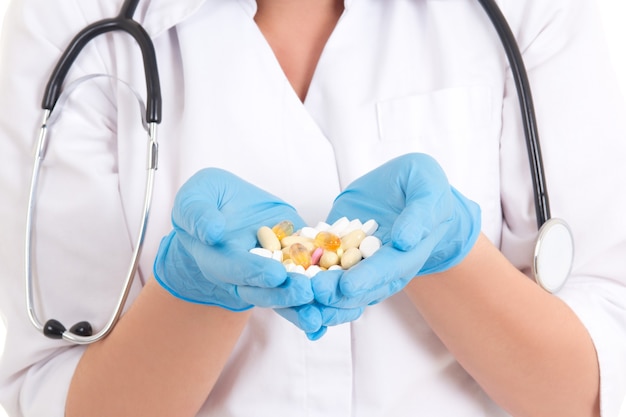 Pills and vitamins in female doctor's hands