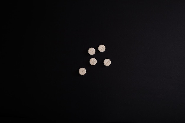 Pills vitamins medicine macro photo on background