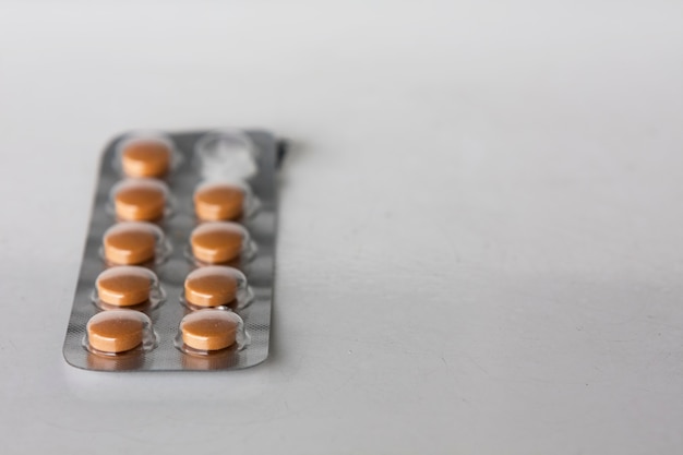 Pills on white background. Macro shot of therapy tablets 