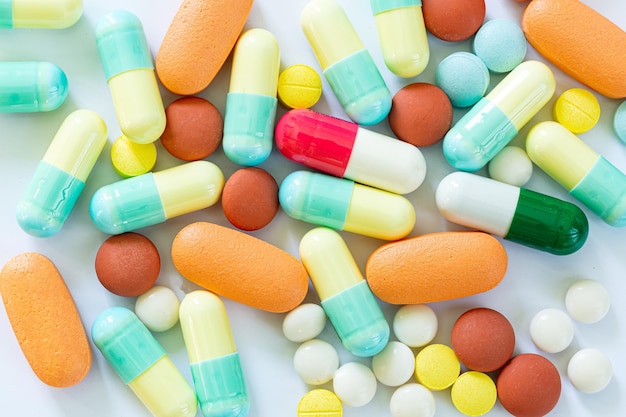 Pills on a white backgroundstack of different pills isolated on\
white background