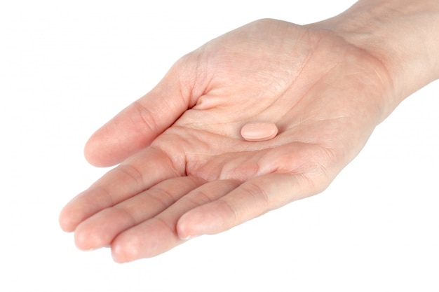 Pills in woman hand