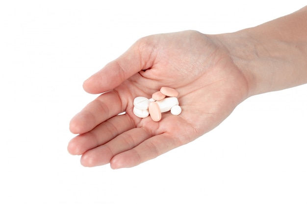 Pills in woman hand