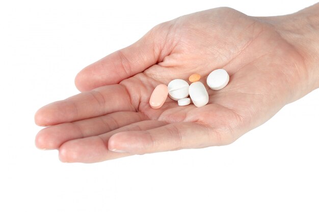 Pills in woman hand