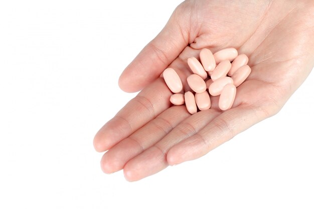 Pills in woman hand