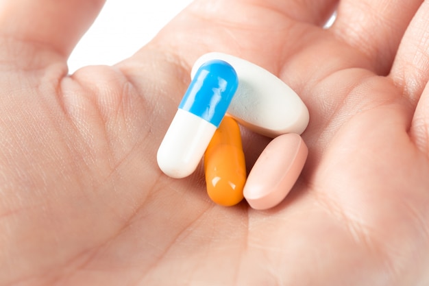 Pills in woman hand