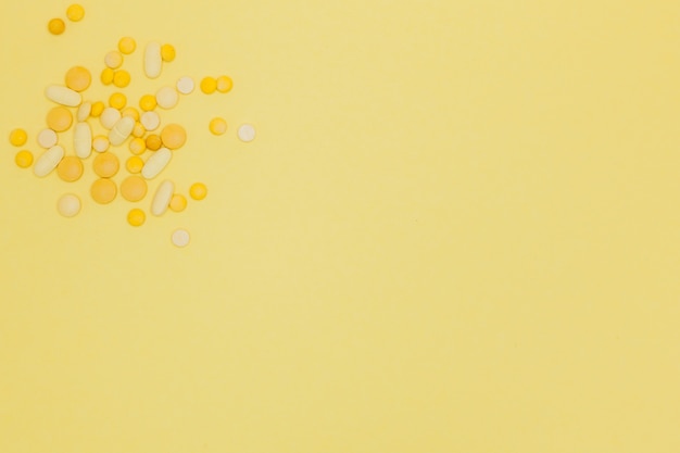 Pills on a yellow background