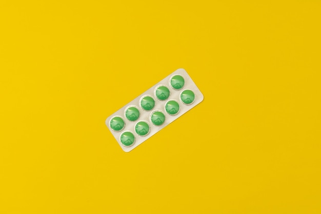 Pills on a yellow background